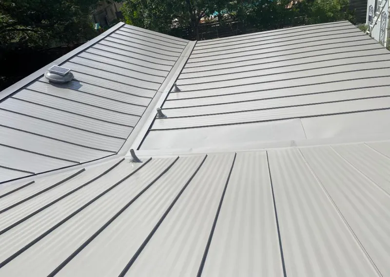 Solar attic fan installed on a metal roof for Roof Ventilation in Kodiak